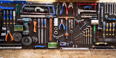 Plumbing tools hanging on wall